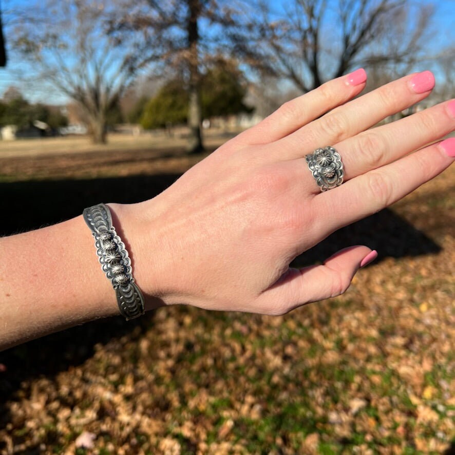 Sterling Silver Stamped Ring, small concho buttons, band by Navajo artist, BENNY RAMONE